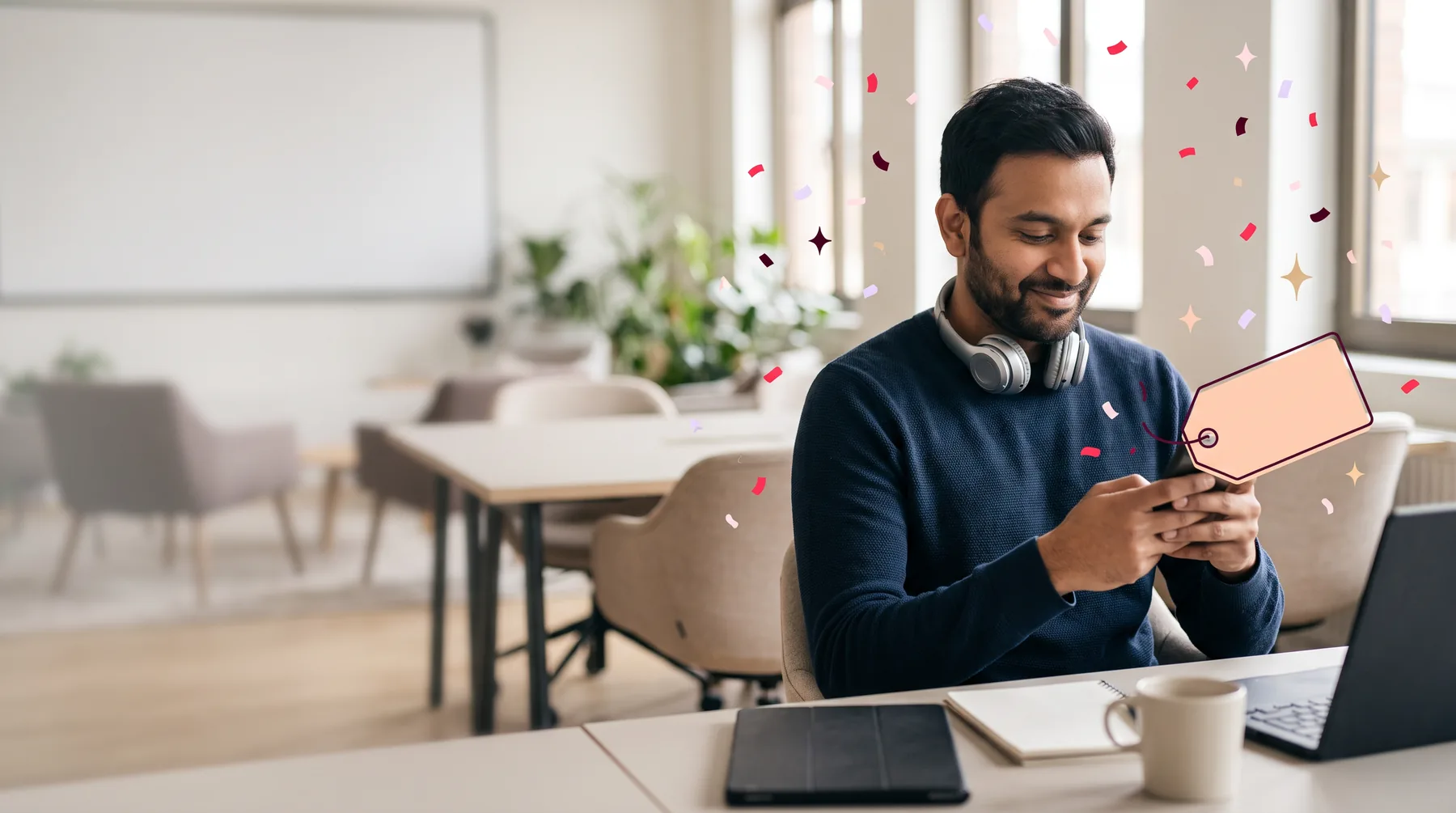 Researcher in a studio with a headset around his neck, smiling at his phone after a session