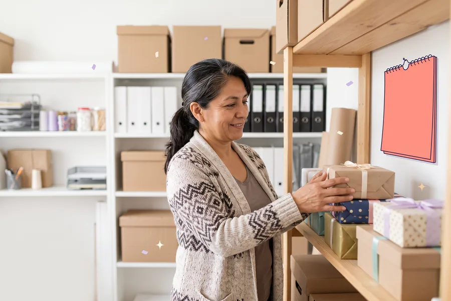 Woman in an office storeroom checking a shelf of stacked gift boxes