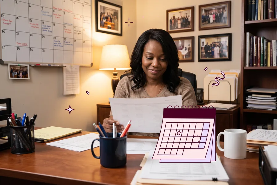 Church office with a wall calendar of handwritten dates and a desk of printed rosters