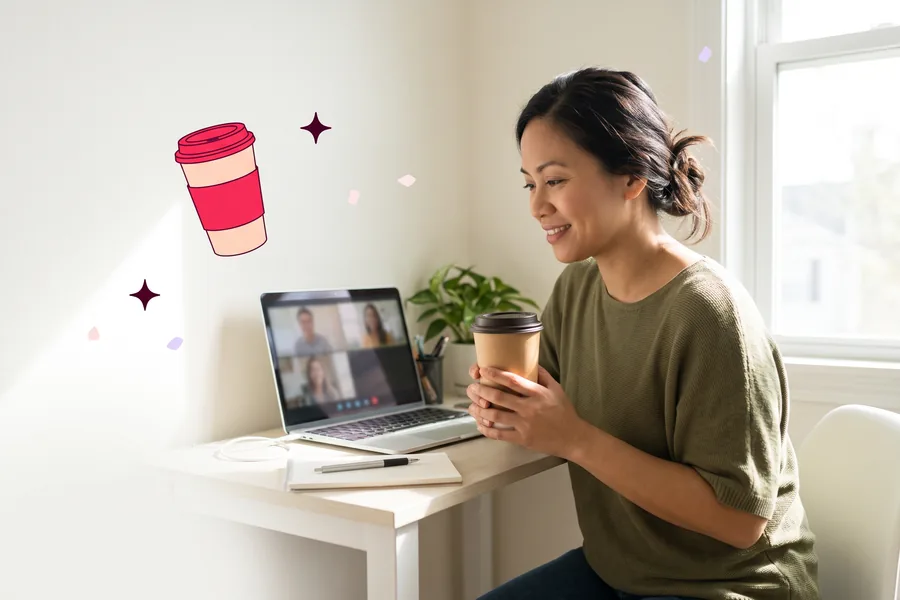 Remote employee on a video call at a home desk, holding a coffee cup