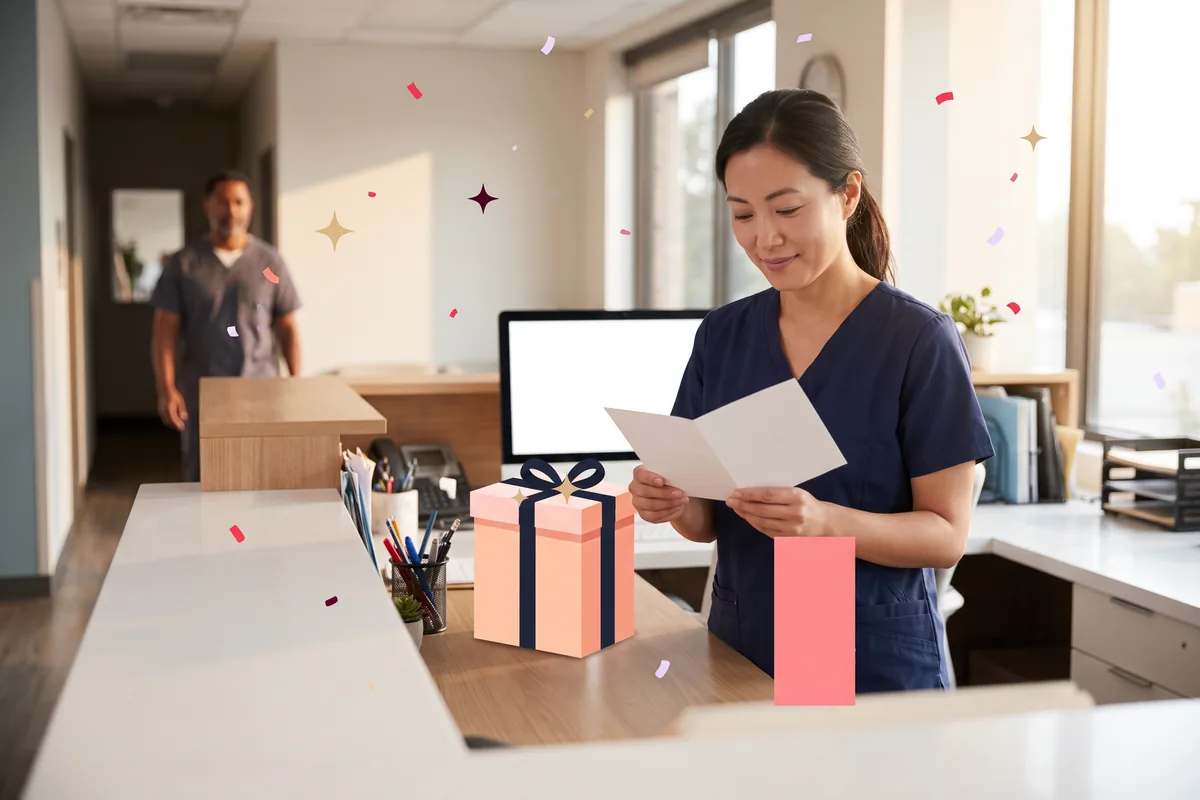 Clinic receptionist reading the card that came with a gift box on the counter